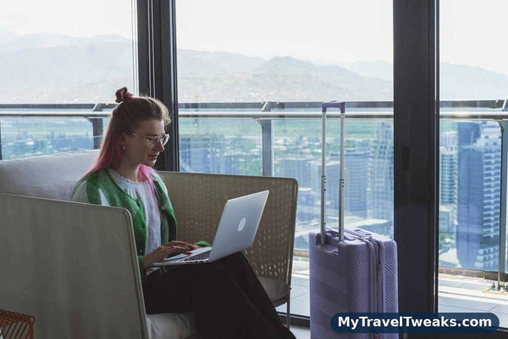 Comparing hotel offers on a laptop in a hotel lounge