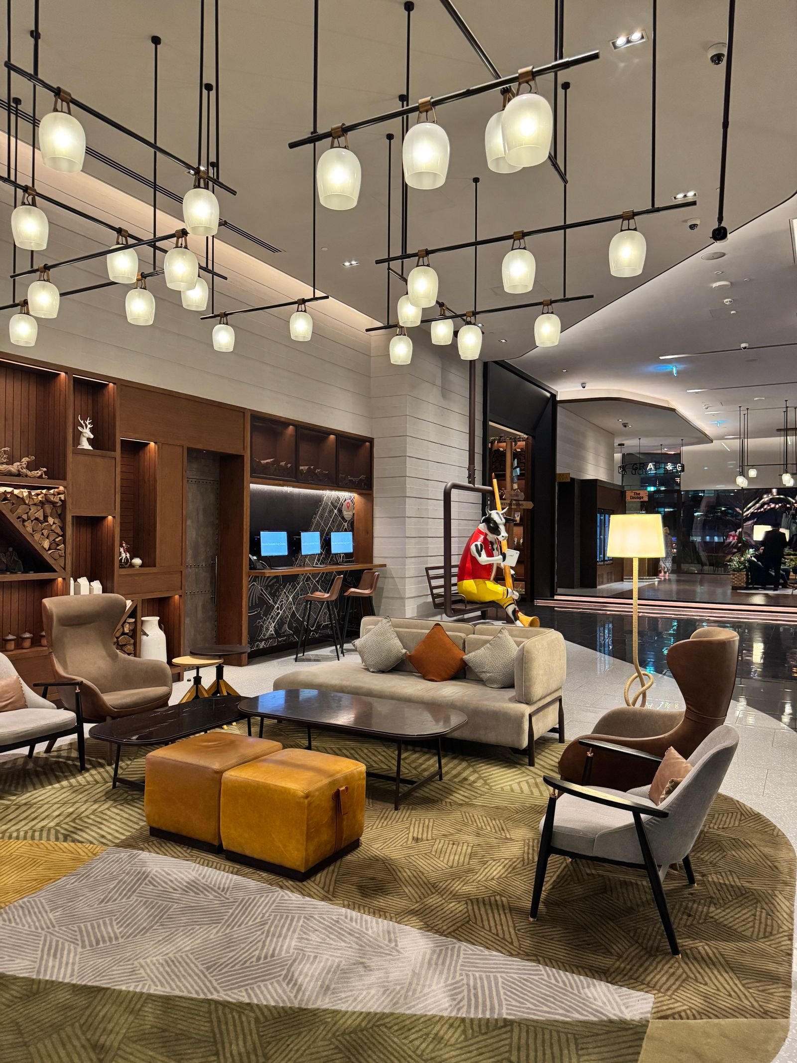 Modern hotel lobby with stylish decor and lighting