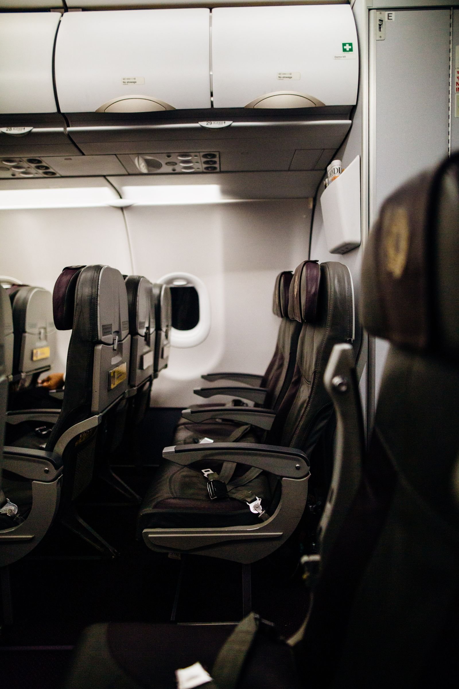 Rows of seats inside a modern airliner cabin