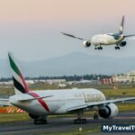 Two airliners on the runway at sunset — one route, two ways to book it