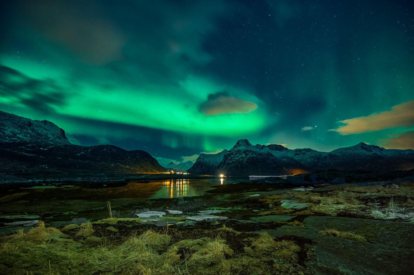 Northern lights shining over mountain peaks on a clear night